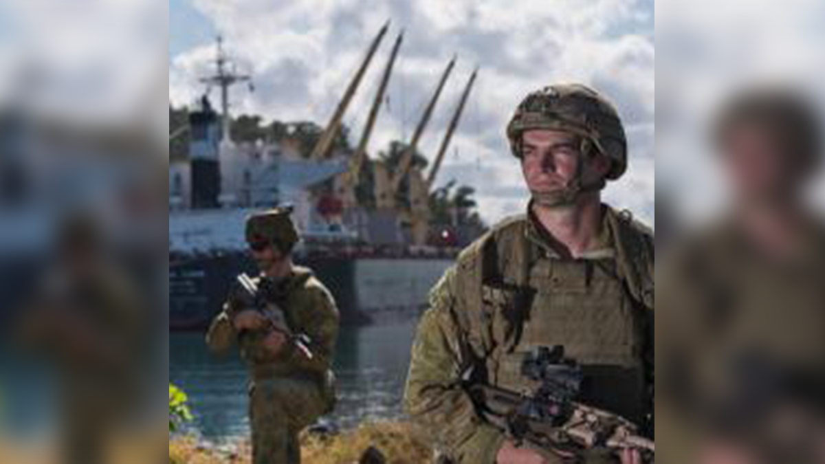 Soldiers in front of a shoreline