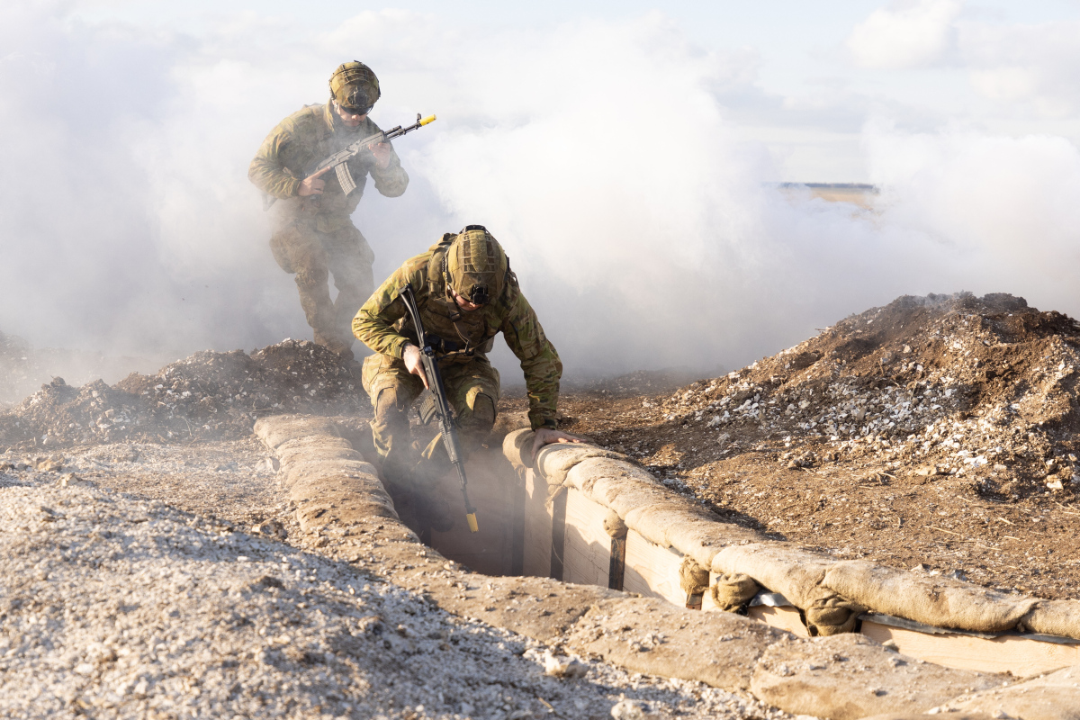 Australian Army soldiers from the 5th Battalion, Royal Australian Regiment, demonstrate trench warfare tactics to Ukrainian trainees during the first rotation of Operation Kudu in the United Kingdom.