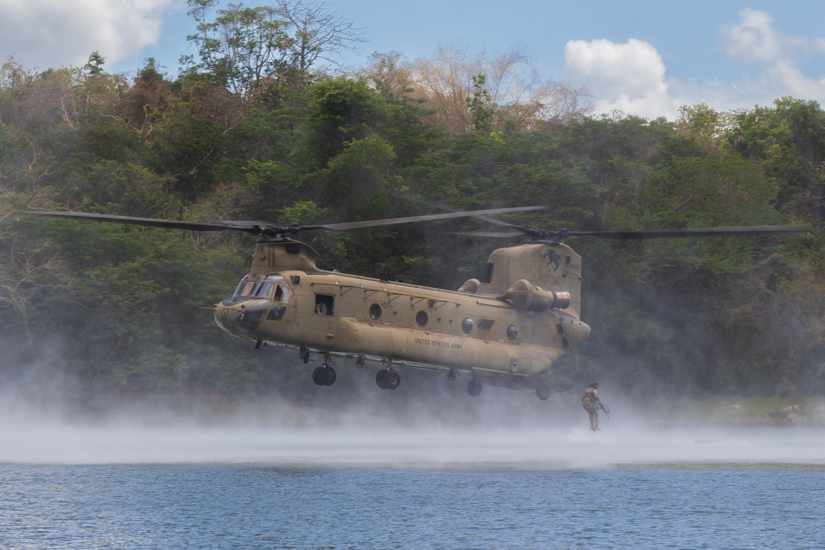 Personnel from the Australian Army, United States Army and Armed Forces of the Philippines swim to shore after helocasting from a United States Army CH-47 Chinook at Fort Magsaysay during Exercise Balikatan, Philippines.