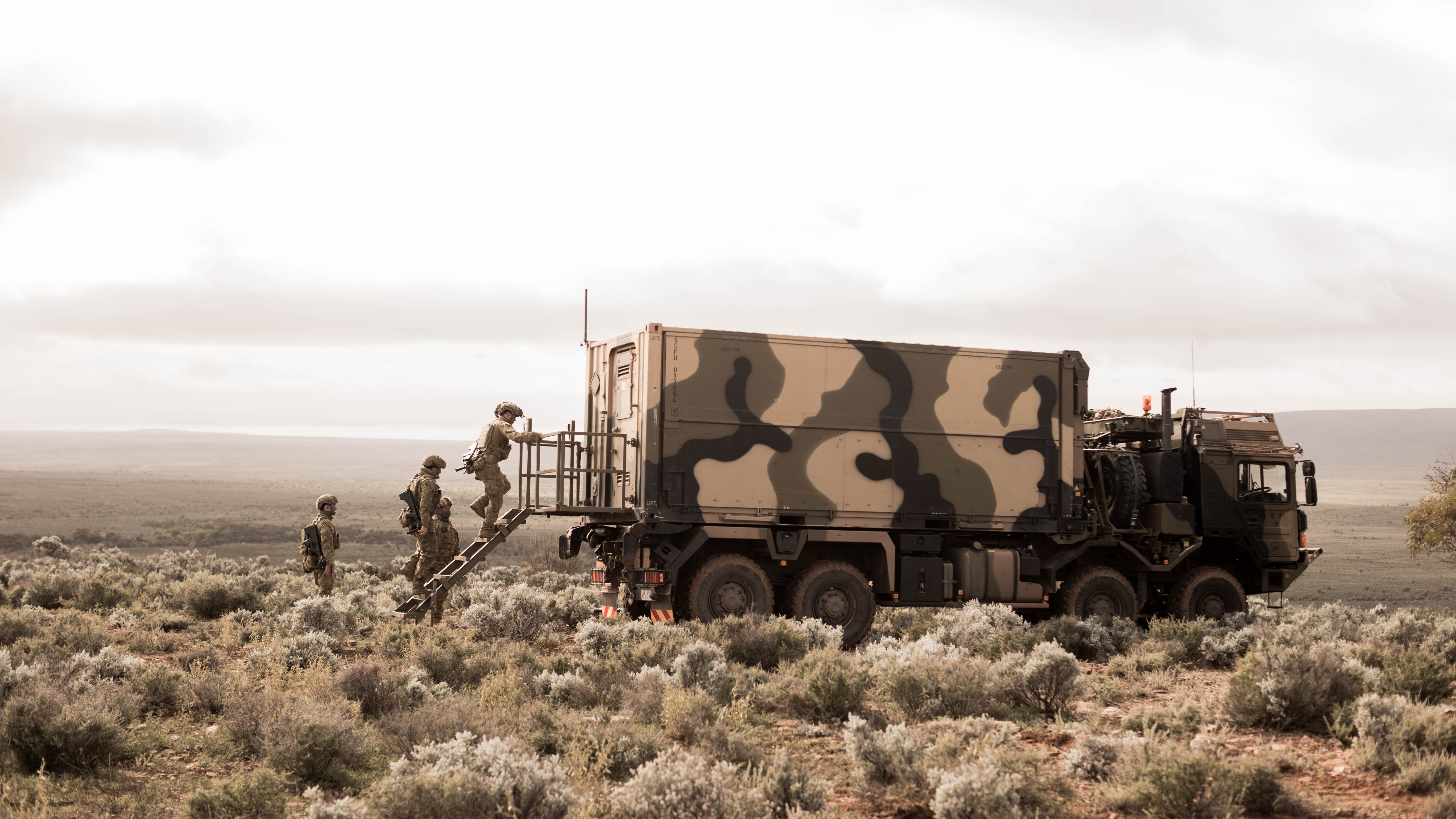 Australian Army soldiers enter the Deployable Advanced Manufacturing Shelter at Cultana Training Area, during Exercise Black Prince 3.