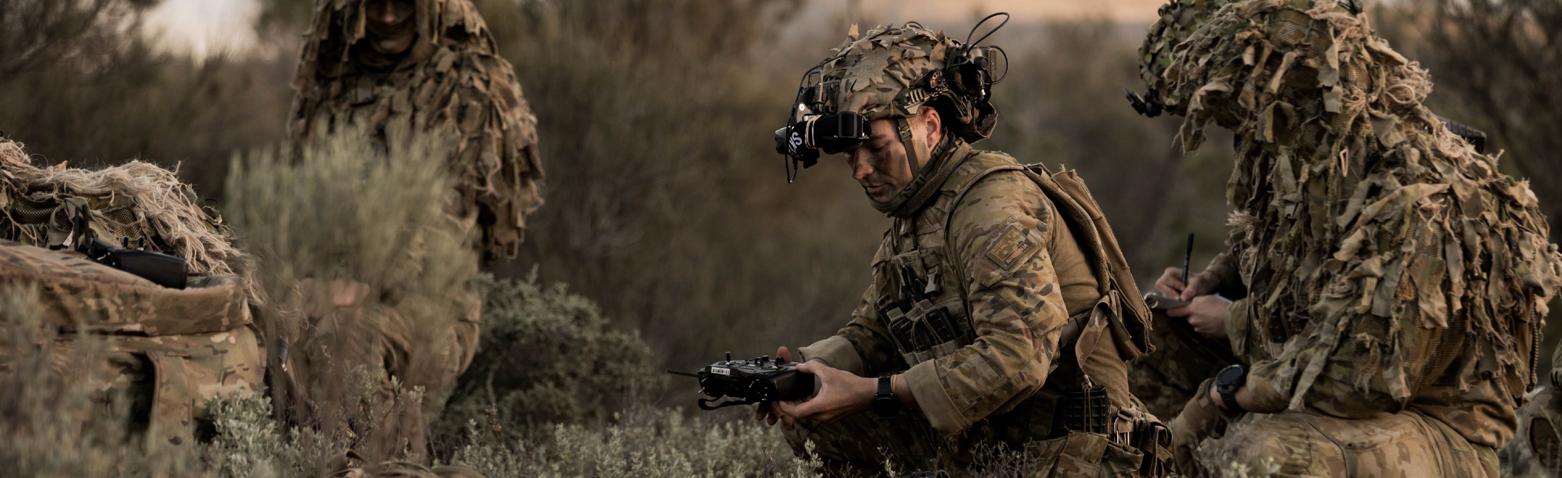 Soldier crouching with UAV remote