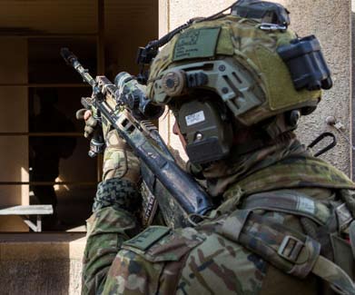 An Australian soldier conducts a room clearance during Exercise Rimpac.