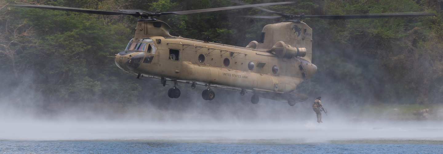 Personnel from the Australian Army, United States Army and Armed Forces of the Philippines swim to shore after helocasting from a United States Army CH-47 Chinook at Fort Magsaysay during Exercise Balikatan, Philippines.