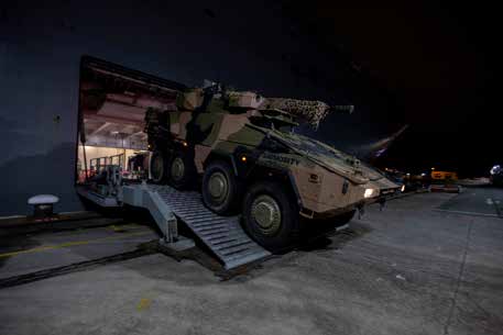 Boxer Combat Reconnaissance Vehicle disembarks from HMAS Adelaide in Singapore.