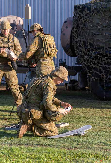 Soldiers from 9th Regiment, Royal Australian Artillery, prepare a drone.