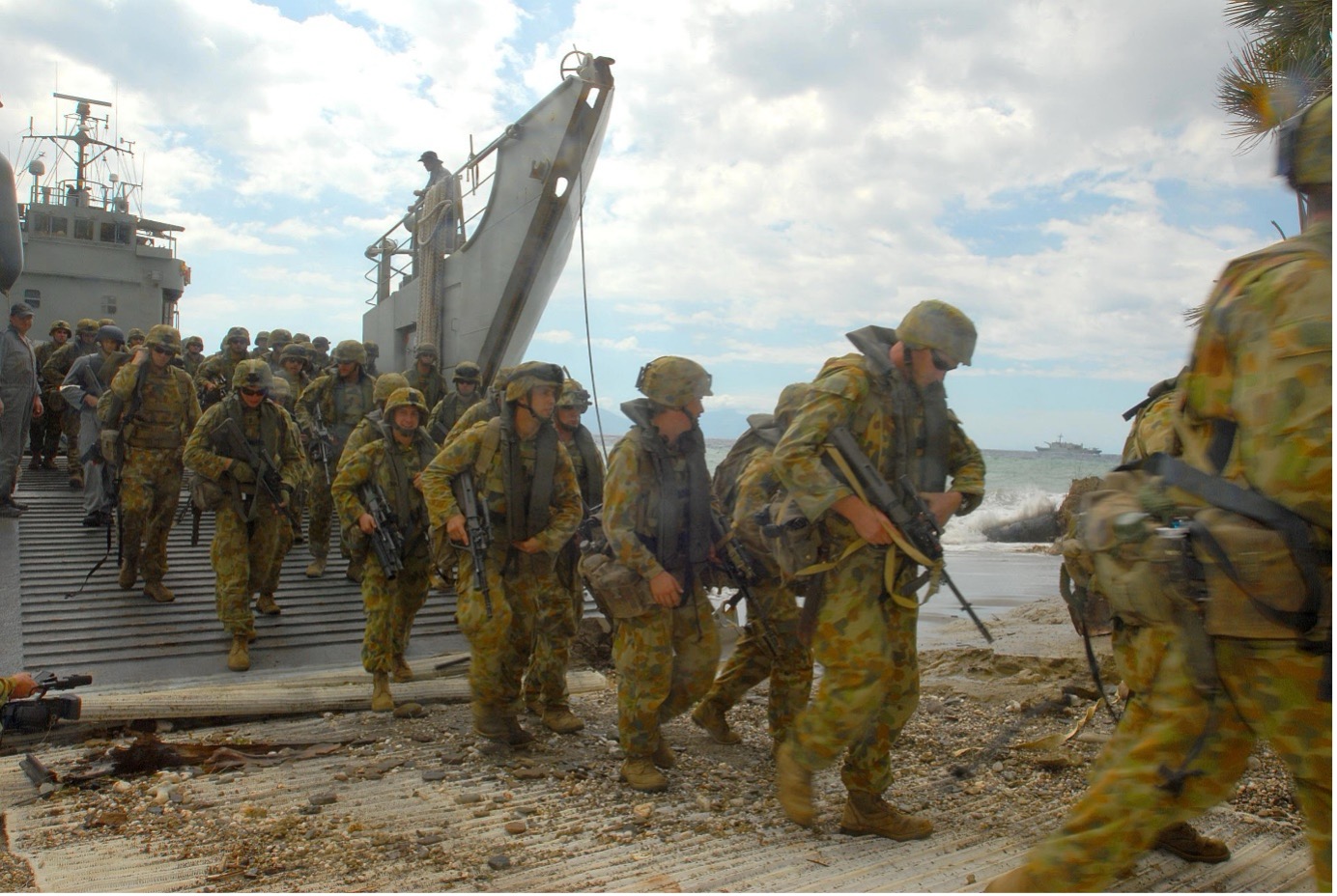 Australian Army troops disembark onto a beach