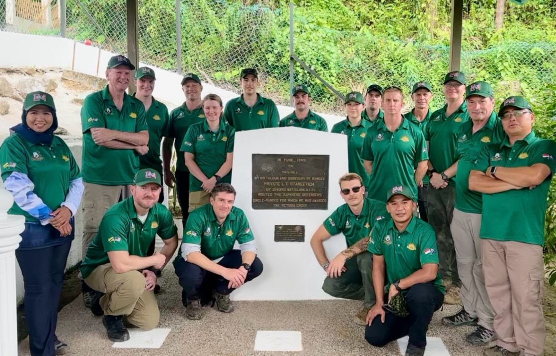Photograph of staff ride group at Starcevich VC memorial monument, Beaufort
