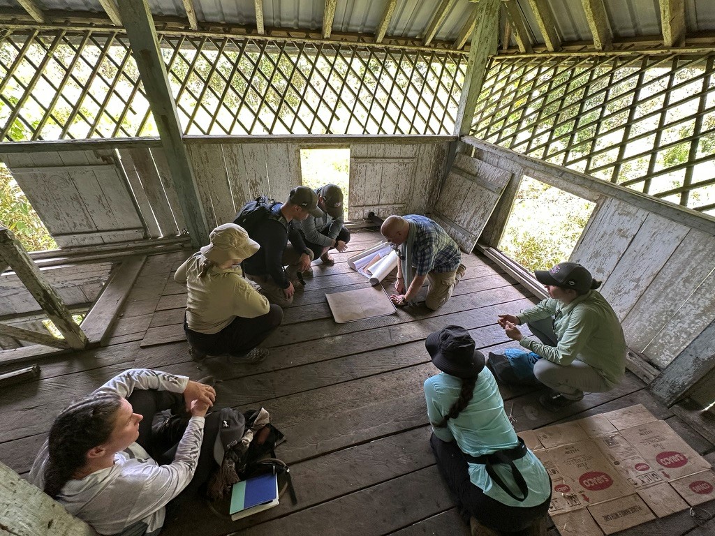 Photograph of staff ride briefing by historian, Long Akah fort, northern Sarawak