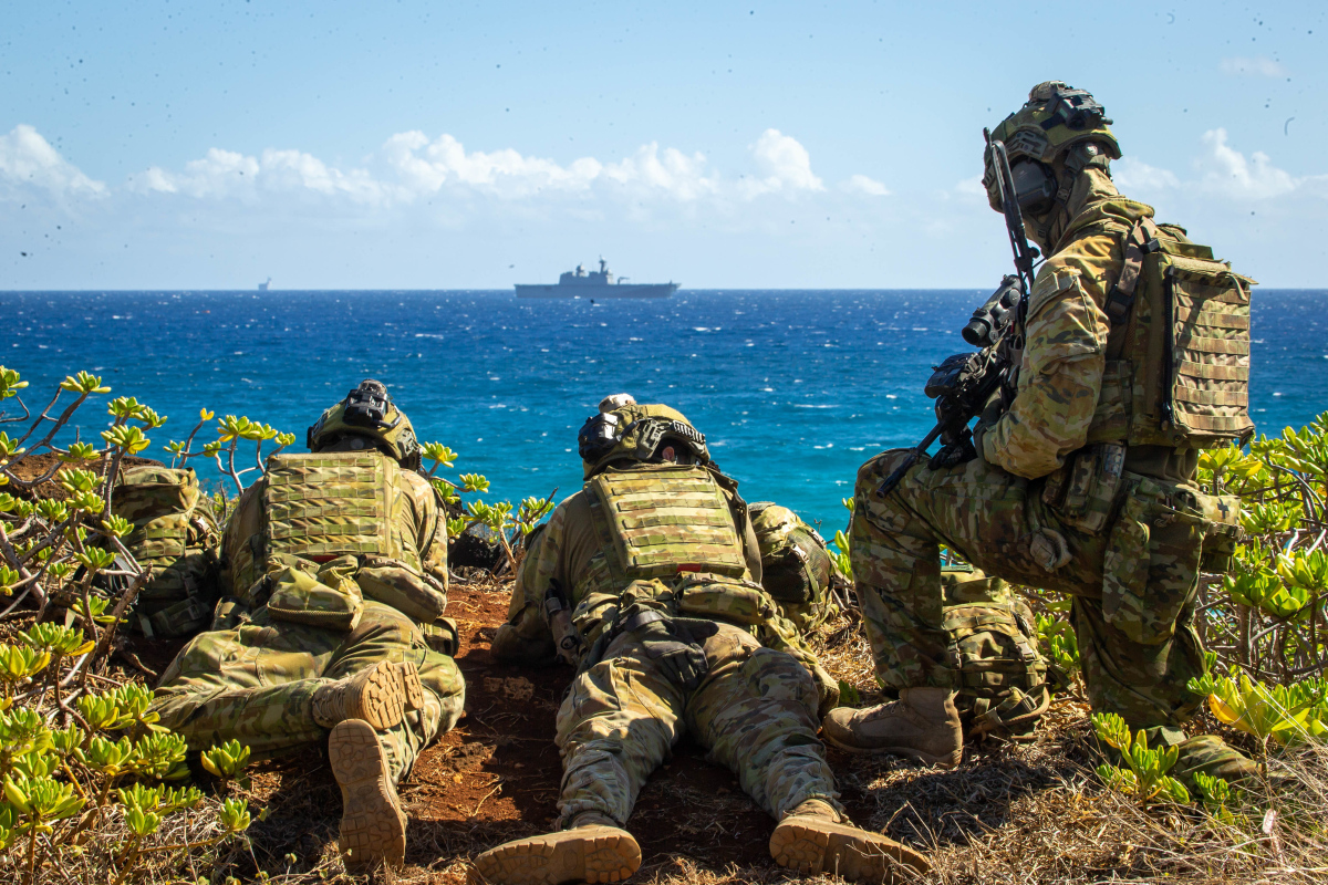 Australian Army Soldiers post security during an amphibious raid for a multinational littoral operations exercise as part of Rim of the Pacific (RIMPAC) 2022.