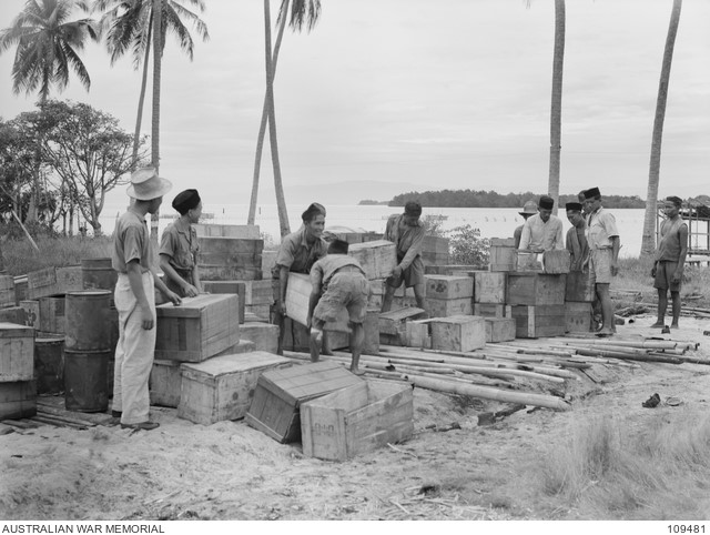 Native employees stacking stores at Headquarters 20 Infantry Brigade.