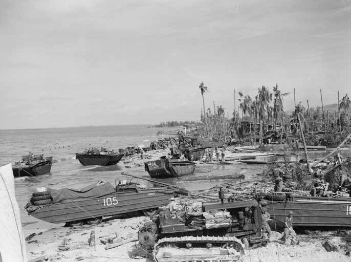 The view looking along Yellow Beach soon after the Operation  OBOE II landing at Balikpapan, Borneo, in 1945. DUKW and Landing  Vehicle Tracked vehicles are in the foreground.