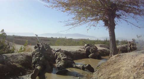 Members of 2nd Battalion, Royal Australian Regiment - accompanied by soldiers of the Afghan National Army - engage insurgents during a contact in Afghanistan, 2011.