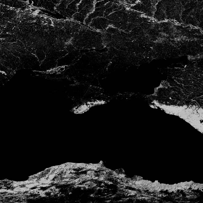 This black and white satellite photograph shows the region around the Black Sea. Dark areas on the land indicate vegetation.
