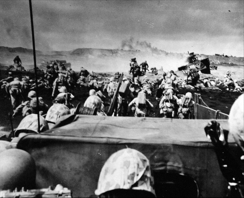 A wave of 4th Division Marines beginning an attack from the beach at Iwo Jima, 19 February 1945. (Source: National Museum of the U.S. Navy 80-G-304-843)