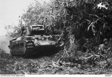 Troops advance alongside a Matilda tank