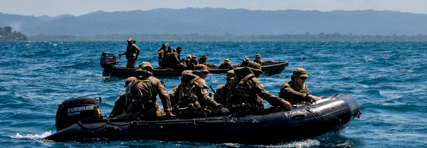 Small boat patrol teams on water.