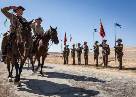 The Guidons of the 4th and 12th Australian Light Horse Regiments are saluted during the centenary re-enactment of the Battle of Beersheba in Israel.
