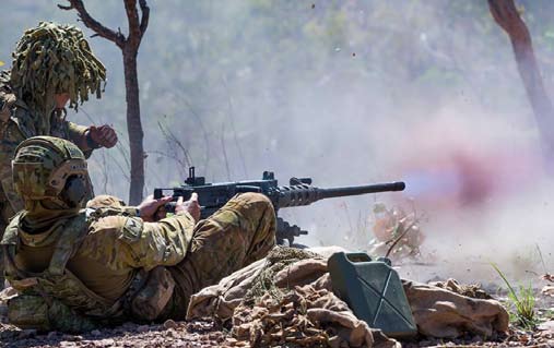 The crew of a Browning M2 .50 calibre machinegun engage a target.