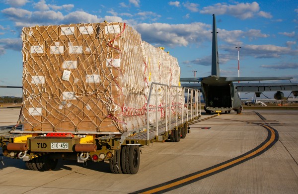 Personal Protective Equipment, destined for Indonesia, prior to being loaded on to a No. 37 Squadron C-130J Hercules at RAAF Base Amberley.
