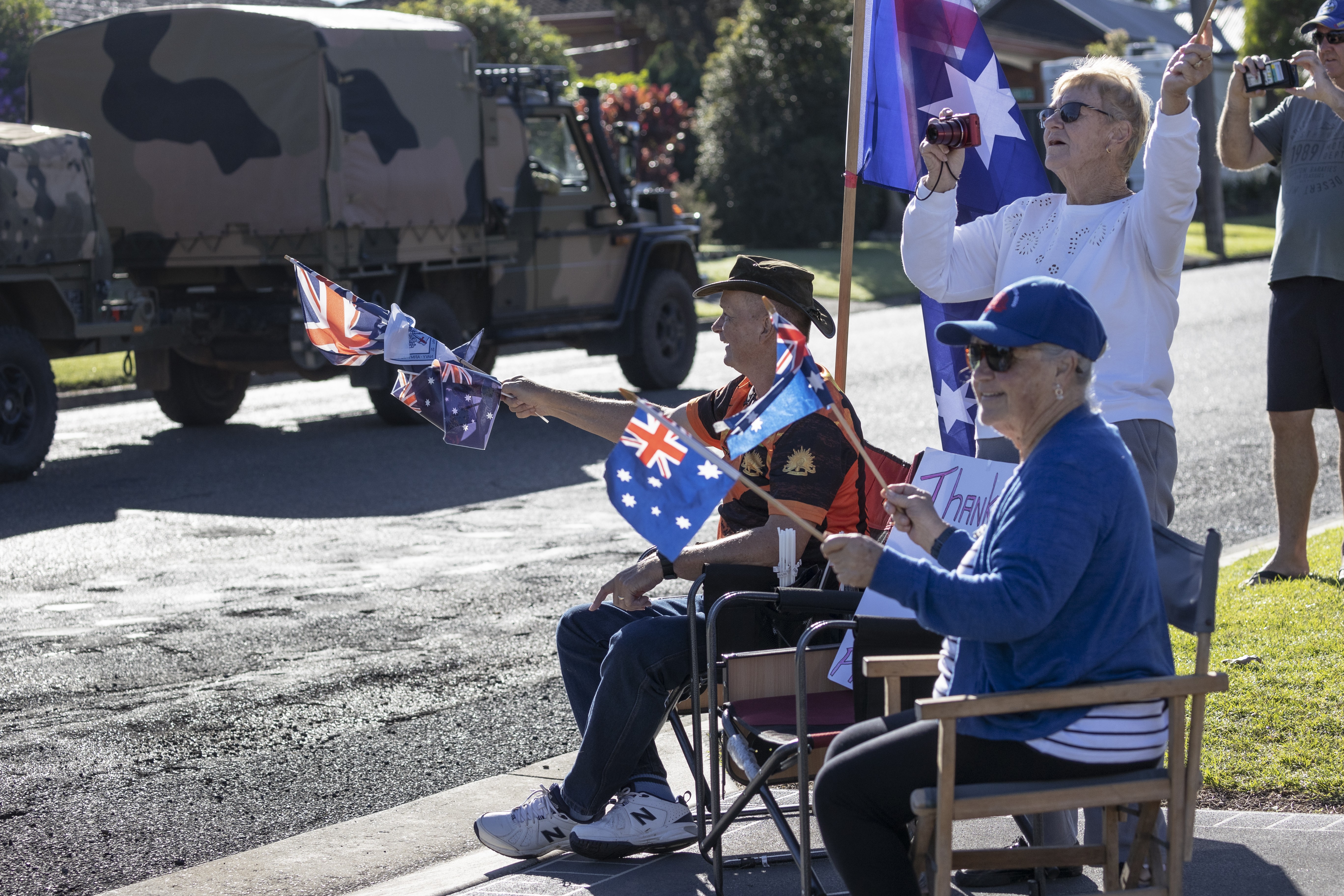 Taree, New South Wales resident Mr Darcy Elbourne with his wife and friends show their appreciation to Australian Army personnel after they conduct relief and recovery tasks during Operation NSW Flood Assist.