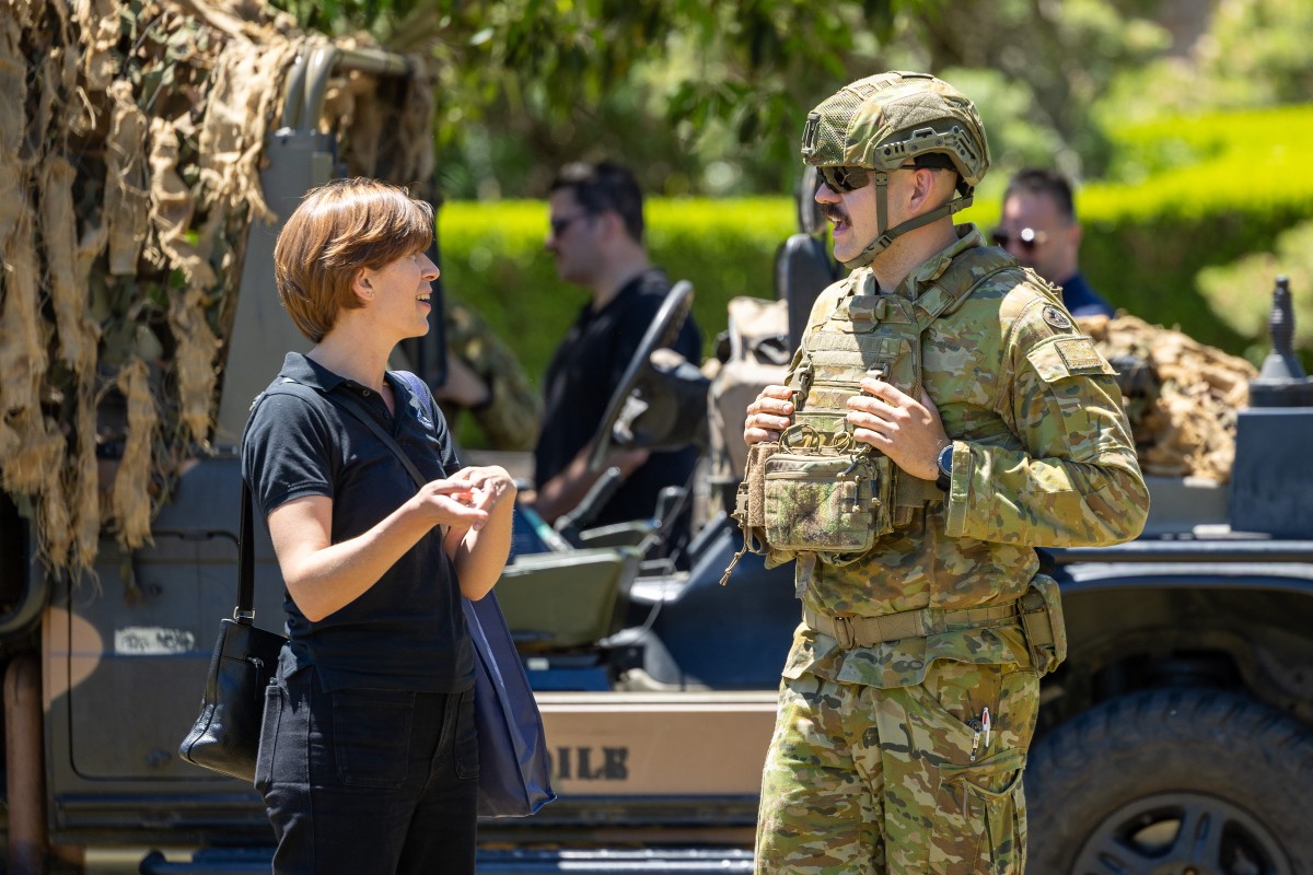 An invited guest from the National Employer Support Awards talks with an Australian Army solider at Victoria Barracks, NSW.