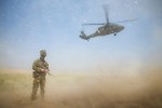 Australian Army soldier Corporal Donovan Murphy provides force protection as Commanding General Combined Joint Forces Land Component Command – Operation Inherent Resolve Major General Gary J. Volesky departs the Taji Military Complex in Iraq aboard a United States Blackhawk helicopter.