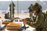 Australian Army soldier Corporal Jaye Griffen, from Task Group Taji 4, loads AK-47 magazines for an Iraqi Ninewah Police training audience at Taji Military Complex, Iraq.