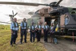 Royal Solomon Islands Police Force Officers prepare to depart Honiara on an Australian Defence Force MRH-90 Taipan helicopter bound for the outlying provinces of Gizo, Ringii and Seghe in the Solomon Islands prior to the National Government Election.
