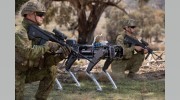 A Ghost Robotics legged robot stands ready with Australian Army soldiers during an autonomous systems showcase at the Majura Training Area, Canberra.