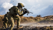 Australian Army soldier Private Tautau Peleseuma from the 2nd Battalion (Amphibious), Royal Australian Regiment, assaults a pit during a platoon attack at Pohakuloa Training Area as part of Exercise Rim of the Pacific 18 (RIMPAC 18).