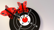 Dartboard with two darts in the centre