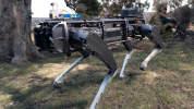 A Ghost Robotics unmanned ground vehicle supports Australian Army soldiers conducting an enemy position clearance during an autonomous systems showcase at the Majura Training Area, Canberra.