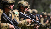 Soldiers with rifles in the shoulder