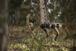 Australian Army soldier Corporal Meg Reeves uses a Ghost Robotics quadruped robot for a reconnaissance task at Mount Pleasant, Canberra.