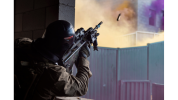An Australian Army rifleman from Alpha Company of 8th/9th Battalion, The Royal Australian Regiment, fires an F88 Austeyr rifle into an "enemy" window during Exercise Ram Horn at Wide Bay Training Area, Queensland.