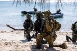 Australian Army Major Rick Hindmarsh, Officer Commanding Joint Pre-Landing Force, conducting a joint TNI Marine and ADF raid during an amphibious beach demonstration in Indonesia on Indo-Pacific Endeavour 2022.