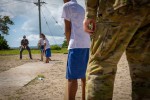 Australian Defence Force personnel play cricket with students from the Faleu primary school, Samoa, during Operation Solania 23-2.