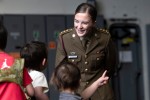 Australian Army Captain Chlorissa-Jayne Bowman-Clift engages with visiting children during HMAS Adelaide’s open day, while on a port visit to Hobart, Tasmania.