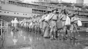 Australian soldiers disembarking a naval ship
