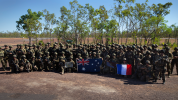 French and Australian soldiers with their countries' flags.