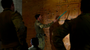 Army briefing from wall in a darkened room