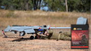 Australian Army crew chief Lieutenant Dallin Stirling attaches post-flight safety tags to a Shadow 200 during Exercise Dragon Sprint at Townsville Field Training Area, QLD.