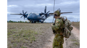 A Royal Australian Air Force airman talks to the C-27J Spartan aircraft crew as they prepare to depart High Range training area near Townsville, Queensland, during Exercise Talisman Sabre 2019.