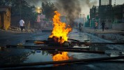 Burning debris in the middle of a street; Image by Fajrul Falah from Pixabay