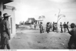 A number of officers and men from Robin Force observing the test firing of one of two six inch heavy coastal artillery guns in a battery recently completed at Ouen Toro, a position overlooking Noumea. Source: Australian War Memorial (P00308.002)