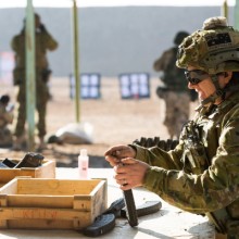 Australian Army soldier Corporal Jaye Griffen, from Task Group Taji 4, loads AK-47 magazines for an Iraqi Ninewah Police training audience at Taji Military Complex, Iraq.