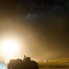 Flare in the background at night.