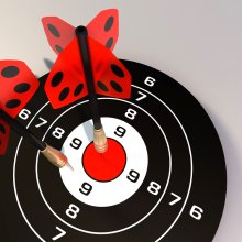 Dartboard with two darts in the centre
