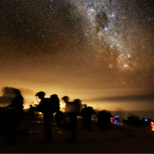 Silhouette soldiers blurred in motion under starry sky