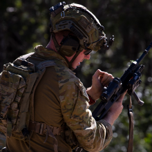 Soldier holding cocking handle